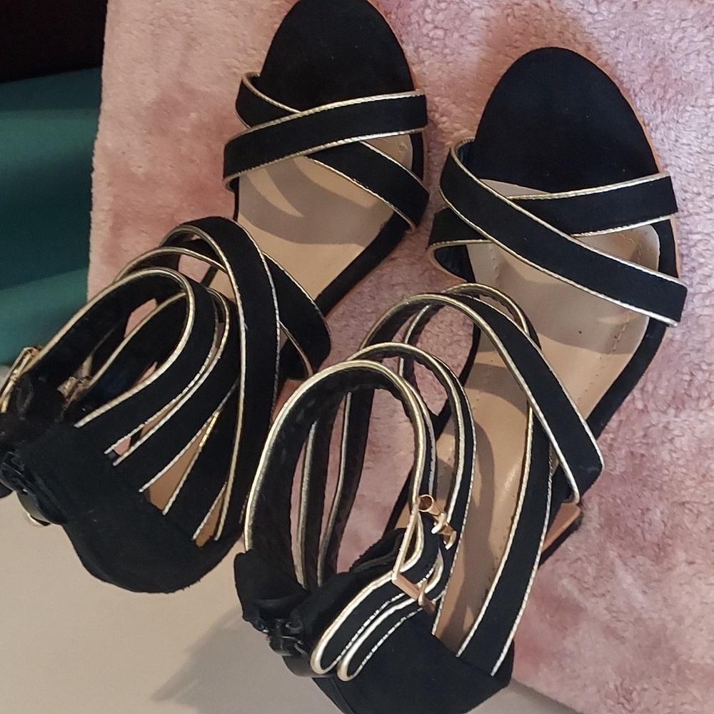 Black heels with gold trim